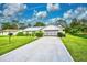 Charming single story home with a two-car garage at 7491 Limonia Dr, Indian Lake Estates, FL 33855