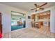 Kitchen with breakfast bar, view of pool, and access to Gathering room at 7491 Limonia Dr, Indian Lake Estates, FL 33855