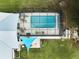 Enclosed pool area with patio furniture at 7491 Limonia Dr, Indian Lake Estates, FL 33855
