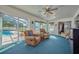 Relaxing sunroom with pool view and comfy seating at 7491 Limonia Dr, Indian Lake Estates, FL 33855