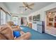 Bright sunroom with sliding doors and a TV at 7491 Limonia Dr, Indian Lake Estates, FL 33855