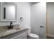 Simple bathroom with white vanity and granite top at 3733 Hill St, Lakeland, FL 33812