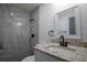 Modern bathroom with granite countertop and updated shower at 3733 Hill St, Lakeland, FL 33812