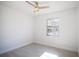 Well-lit bedroom featuring a ceiling fan and new flooring at 3733 Hill St, Lakeland, FL 33812