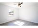 Spacious bedroom with large window and ceiling fan at 3733 Hill St, Lakeland, FL 33812