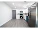 Modern kitchen with white shaker cabinets, granite countertops, and stainless steel appliances at 3733 Hill St, Lakeland, FL 33812