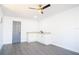 Small kitchenette with white cabinets and granite countertops at 3733 Hill St, Lakeland, FL 33812