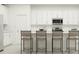 Modern kitchen with white cabinets, island, and stainless steel appliances at 760 Terrapin Dr, Debary, FL 32713