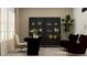 Home office with a desk, chairs, and stylish cabinets at 760 Terrapin Dr, Debary, FL 32713