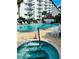 Community pool and hot tub for relaxation at 100 Silver Beach Ave # 906, Daytona Beach, FL 32118