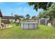 Private backyard with above ground pool and patio at 1375 6 Iron Dr, Lakeland, FL 33801
