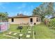 Landscaped backyard with above ground pool and patio at 1375 6 Iron Dr, Lakeland, FL 33801