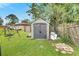 Large backyard with storage shed and playset at 1375 6 Iron Dr, Lakeland, FL 33801