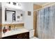 Clean bathroom with a shower/tub combo, vanity, and updated fixtures at 1375 6 Iron Dr, Lakeland, FL 33801