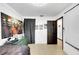 Bedroom with large Joker poster, dresser and door to hallway at 1375 6 Iron Dr, Lakeland, FL 33801