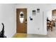 Bright entryway with wood door and tiled floor at 1375 6 Iron Dr, Lakeland, FL 33801