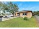 Single-story home featuring a grassy front yard at 1375 6 Iron Dr, Lakeland, FL 33801