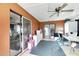Bright Florida room with sliding glass doors and ceiling fan at 1375 6 Iron Dr, Lakeland, FL 33801