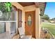 Inviting front entrance with a decorative door and wreath at 1375 6 Iron Dr, Lakeland, FL 33801
