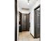 Clean hallway with neutral-colored walls and tile flooring at 1375 6 Iron Dr, Lakeland, FL 33801