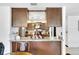 Open kitchen with breakfast bar and view of dining area at 1375 6 Iron Dr, Lakeland, FL 33801