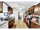 Spacious kitchen with dark wood cabinets and granite countertops at 1375 6 Iron Dr, Lakeland, FL 33801