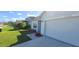 House exterior, garage view with landscaping at 2986 Greenhill Way, Saint Cloud, FL 34772