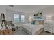 Main bedroom with a king-size bed and neutral color scheme at 4226 Nightcaps Way, Kissimmee, FL 34746