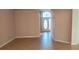 Light brown tile flooring and neutral walls in the entryway at 1149 E Grove Ave, Lake Wales, FL 33853