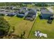 Aerial view of houses with solar panels and fenced backyards at 2613 Camden Park Loop, Davenport, FL 33837