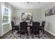 Bright dining room with large table and beautiful artwork at 2613 Camden Park Loop, Davenport, FL 33837