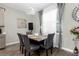 Formal dining room with gray chairs and marble top table at 2613 Camden Park Loop, Davenport, FL 33837