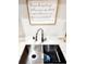 Modern double sink with a stylish faucet and decorative soap dispenser at 21 Peterlee Ct, Kissimmee, FL 34758