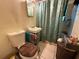 Clean bathroom with toilet, sink, and shower at 303 W Valencia St, Lakeland, FL 33805