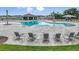 Resort-style pool with lounge chairs and a shaded seating area at 4136 Singing Mockingbird Blvd, Bartow, FL 33830