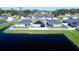 Aerial view showcasing home's backyard, solar panels and pond at 6855 Mossy Oak Ln, Lakeland, FL 33810