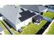Aerial view of house featuring solar panels and a backyard patio at 6855 Mossy Oak Ln, Lakeland, FL 33810