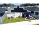 Aerial view of house showcasing backyard, solar panels, and fence at 6855 Mossy Oak Ln, Lakeland, FL 33810