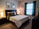 Bedroom with a double bed, window with blinds, and dark wood furniture at 6855 Mossy Oak Ln, Lakeland, FL 33810