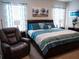 Cozy bedroom with a comfortable queen-size bed and a relaxing atmosphere at 6855 Mossy Oak Ln, Lakeland, FL 33810