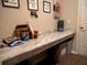 Well-lit laundry room with built-in counter space and storage at 6855 Mossy Oak Ln, Lakeland, FL 33810