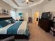 Large main bedroom with a king-size bed and plenty of natural light at 6855 Mossy Oak Ln, Lakeland, FL 33810