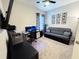 Home office with a desk, chair,futon and plenty of natural light at 6855 Mossy Oak Ln, Lakeland, FL 33810