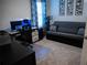 Home office with a desk, chair,futon and plenty of natural light at 6855 Mossy Oak Ln, Lakeland, FL 33810