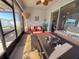 Relaxing screened porch with patio furniture and ceiling fan at 6855 Mossy Oak Ln, Lakeland, FL 33810