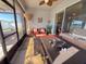 Relaxing screened porch with patio furniture and ceiling fan at 6855 Mossy Oak Ln, Lakeland, FL 33810
