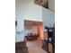 Dining area with a wooden table and chairs, looking toward the kitchen at 106 Seabreeze Cir, Kissimmee, FL 34743