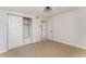 Bedroom with tile floors, built-in shelving, and closet at 2823 Hurst Rd, Auburndale, FL 33823