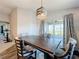 Bright dining room with a large table and view to backyard at 289 Cascara Ln, Auburndale, FL 33823