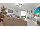 Cozy living room with neutral colored sectional sofa and fireplace at 4310 Trotters Way, Lakeland, FL 33801